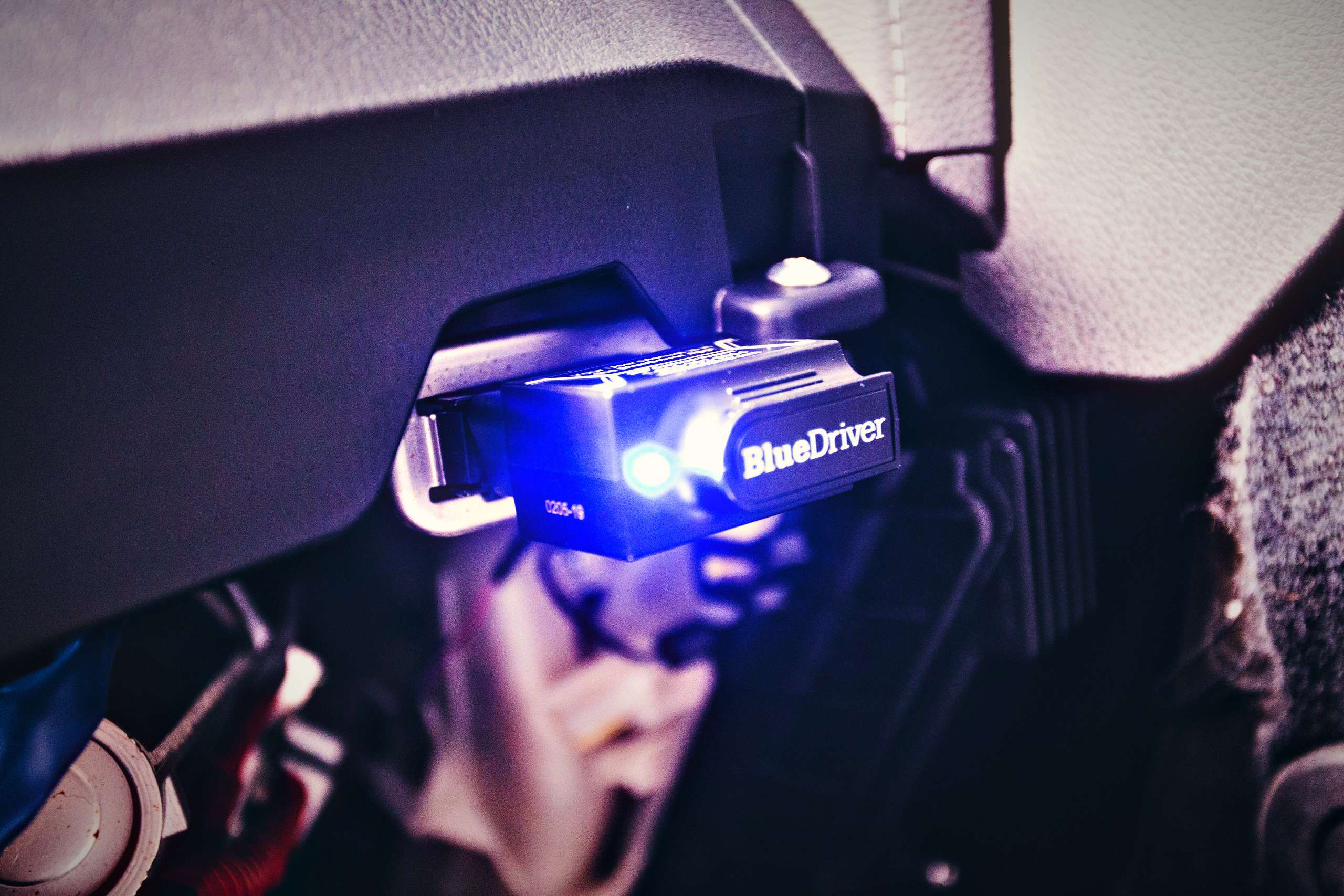 Electronic diagnostic tool plugged into a car