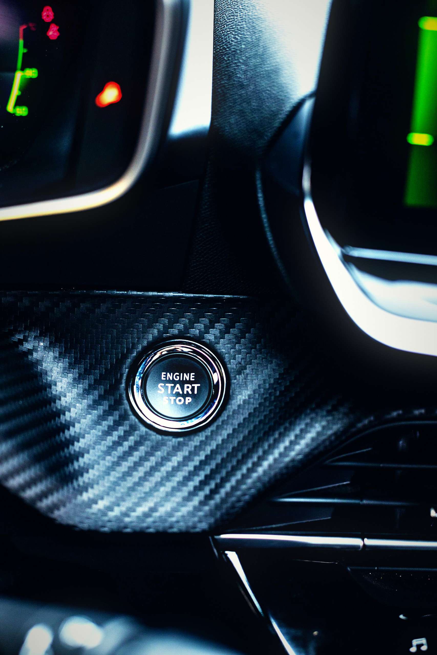 Close-up of a car engine start-stop button