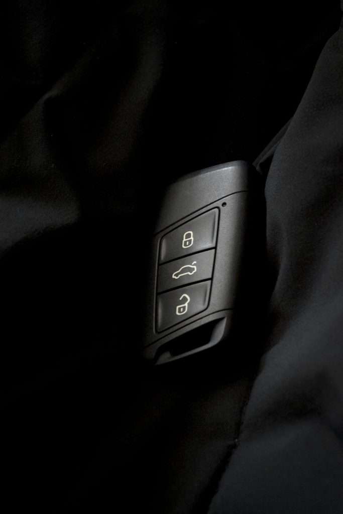 Dramatic close-up of a dark car key fob