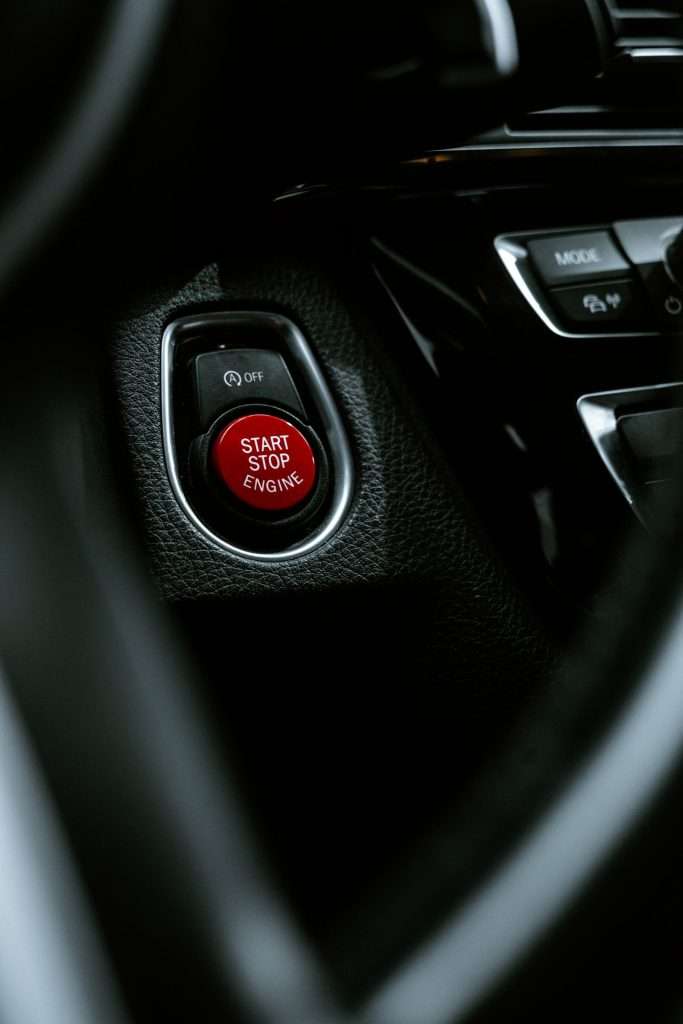 Close-up of a car engine start-stop button